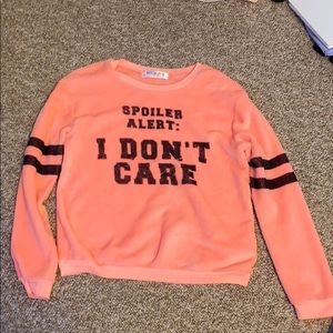 pink fluffy long sleeve shirt with quote